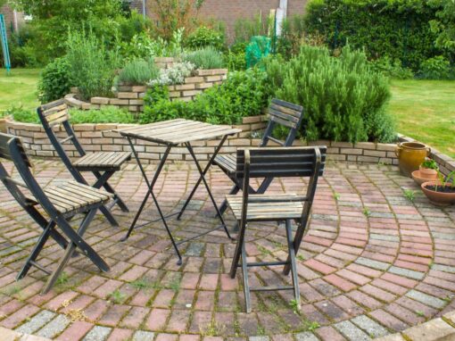 Herb,Spiral,In,The,Garden,And,Table,With,Chairs
